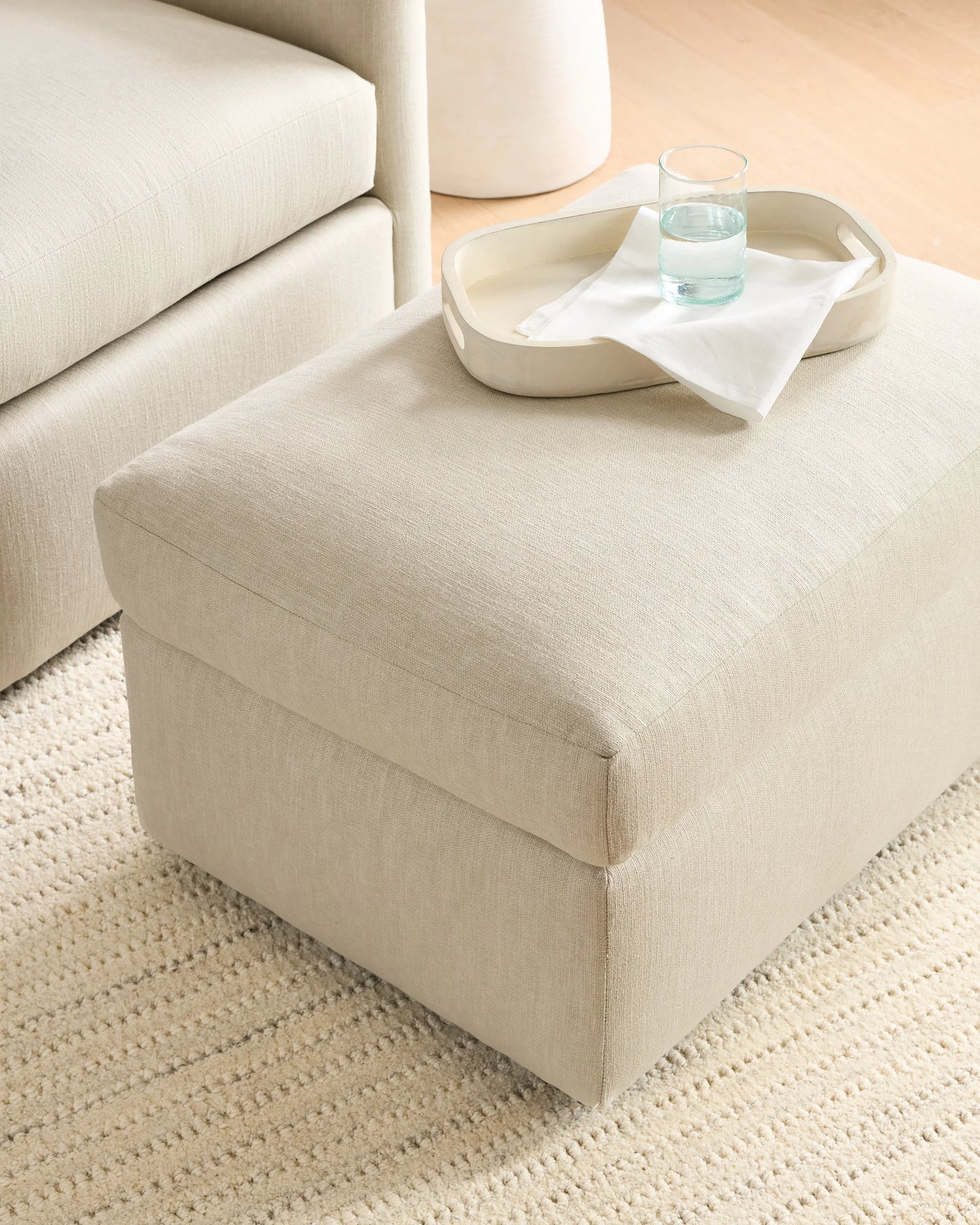 Brennan Ottoman in Performance Basketweave - One Size / Flax